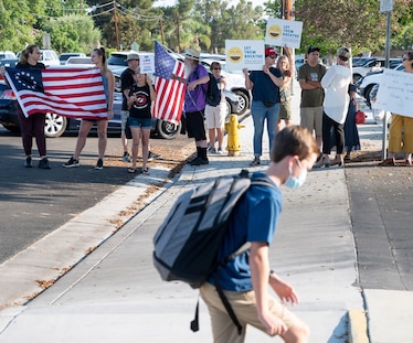 Some 30 protesters rallied outside of Hewes Middle School in Tustin, CA on Friday, August 13, 2021, a day after a student refused to wear a face mask on the first day of school and was sent to wait outside the school's front office. The student did not show up to the beginning of school on Friday but his supporters did, for the second day in a row. The student stayed home, at least early Friday morning, according to a leader with a local "Let them Breathe" group, which opposes mandatory face masks in schools.