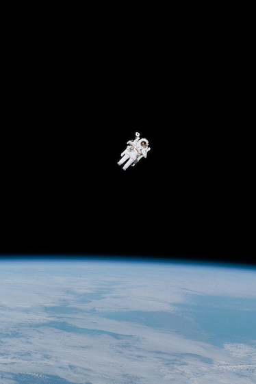 Astronaut free flying in space.