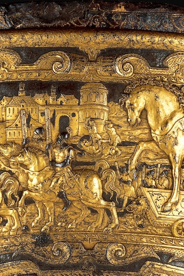a 16th-century saddle showing the Trojans bringing the wooden horse into their city